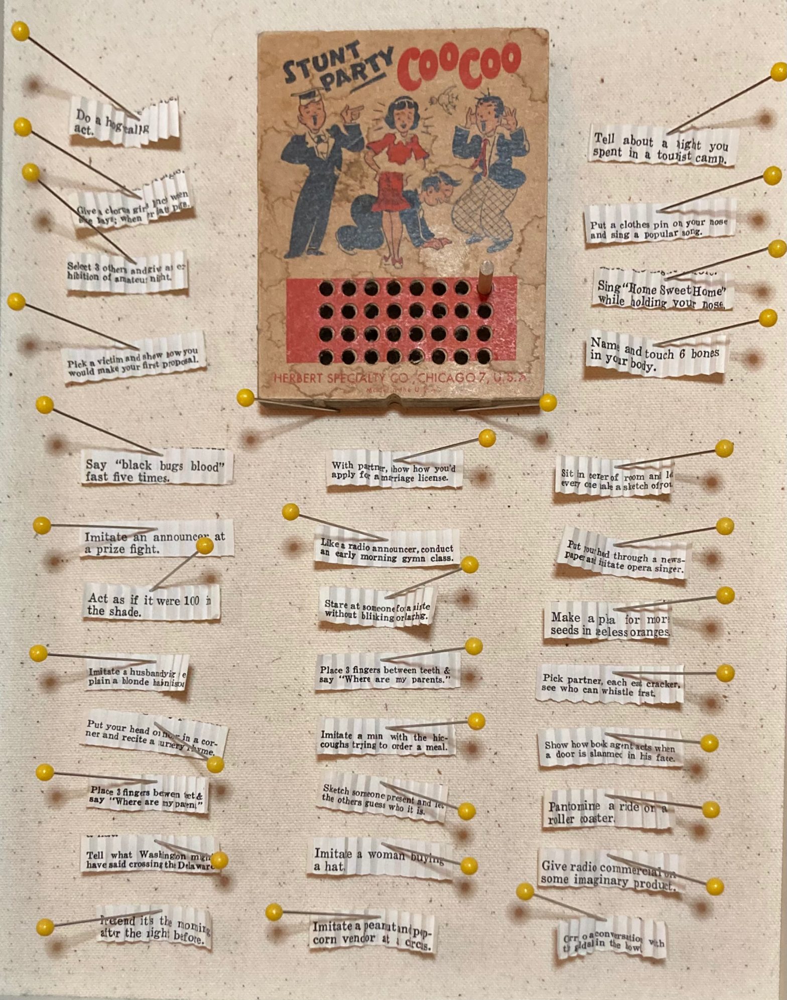 Example of Stunt Party Coo Coo Game that has been played with each part of game displayed including slips of paper with stunts